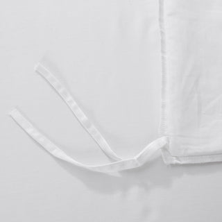 Close-up of a white shirt with a collar on a light gray background