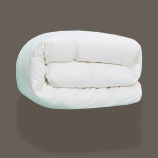 White comforter on a gray background