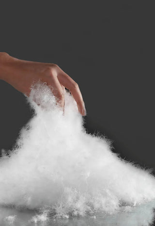 Hands grabbing fluffy down