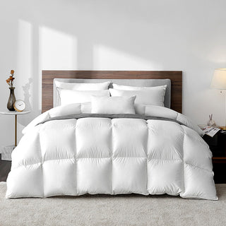 A plush, white duvet filled with ethically sourced goose down Comforter.  Bedding Essential