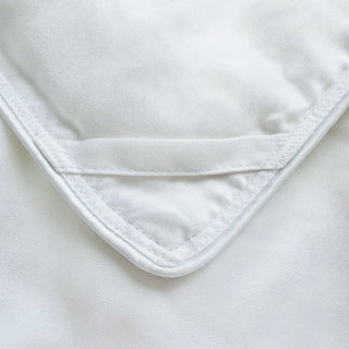 Close-up of a white fabric with a corner tie 