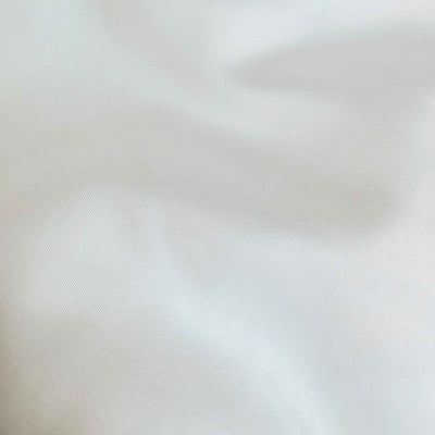 Close-up of a textured white fabric surface