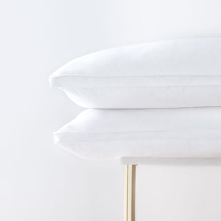 Two Down Touchâ„¢ Pillow on a coffee table