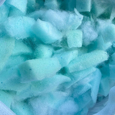 Close-up of blue and white foam cubes from the memory foam filling